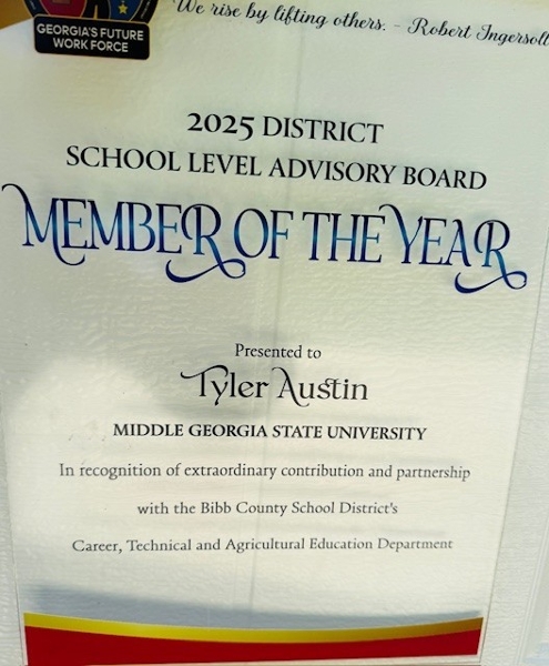 During the May Bibb County Schools Career, Technical and Agricultural Education (CTAE) Board Meeting, MGA and Tyler Austin, University grounds manager, were recognized for their work with Future Farmers of America (FFA) student volunteers, earning the CTAE’s highest award, Advisory Board Member of the Year.